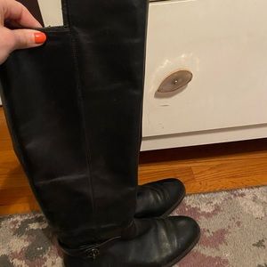 Black leather coach over the knee boots with buckle detail at ankle. Size 38.5
